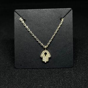 Dainty Hamsa necklace pendant.